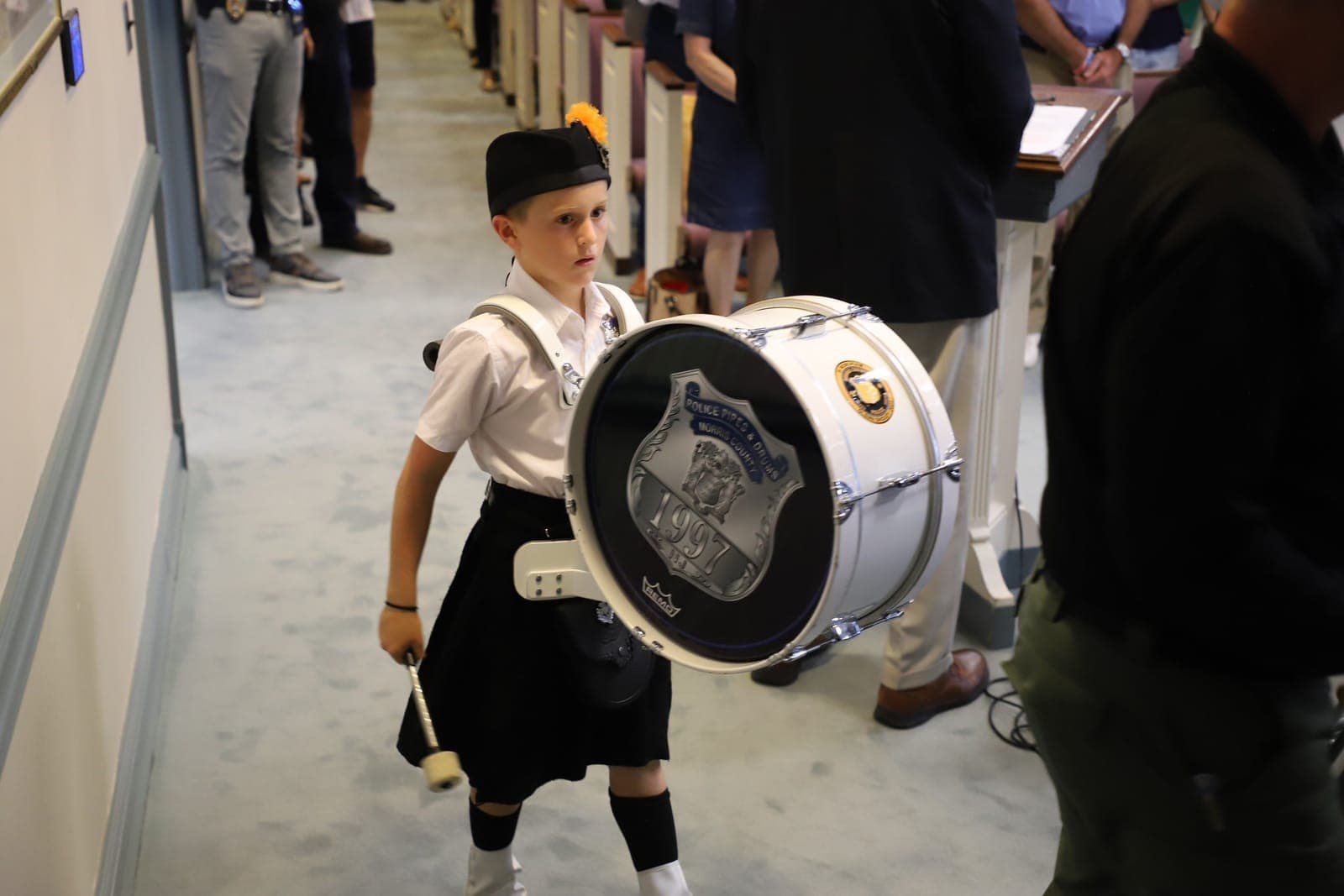 A member of the Morris County Police Pipes and Drums performs at McNally's retirement ceremony.
